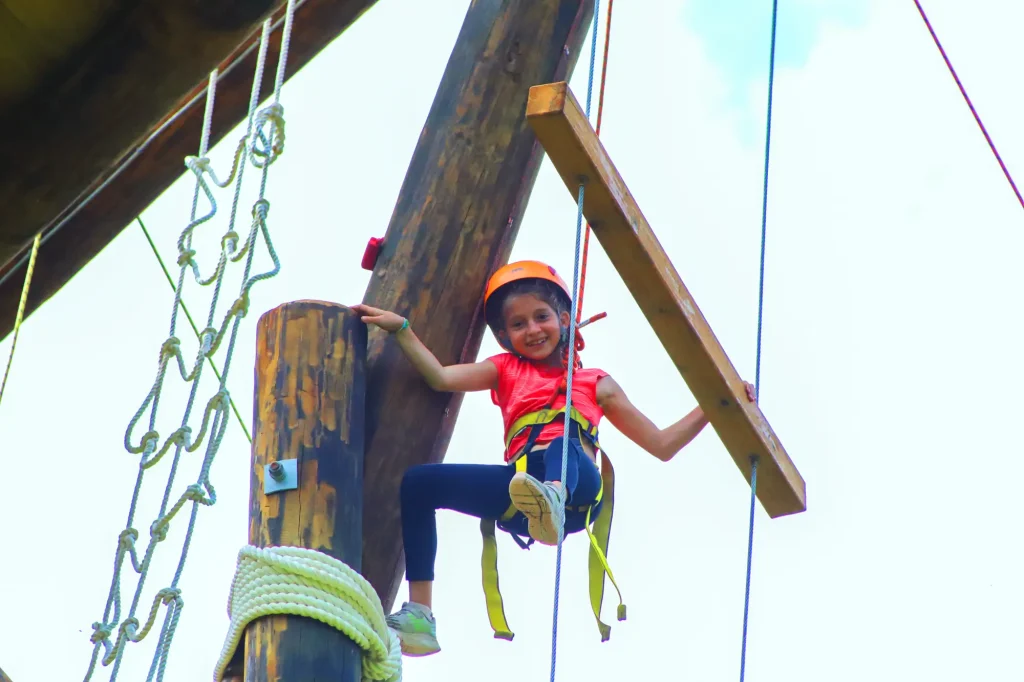 Camper on ropes course
