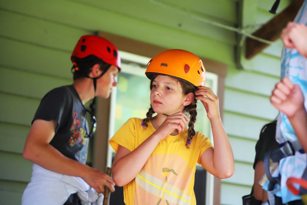 camper getting ready to zip line