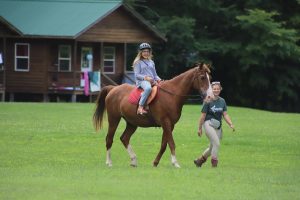 campers enjoying horseback riding