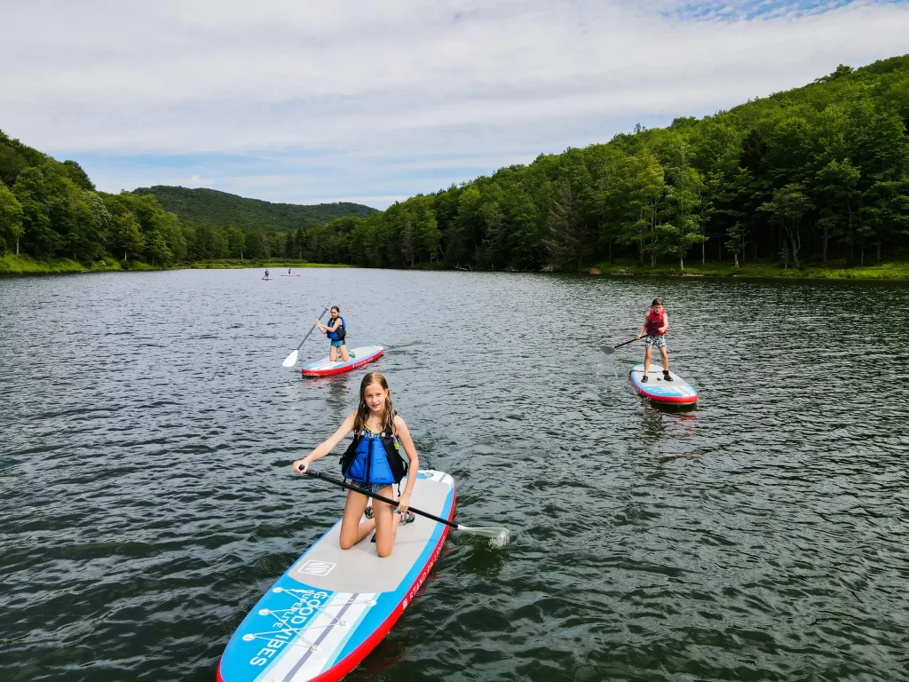 Campers paddleboarding